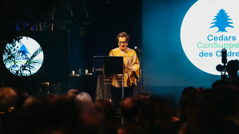 Gwen Nacos presenting to an audience